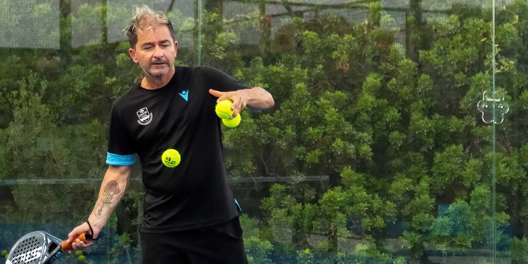 Padel coach during a lesson at the village courts