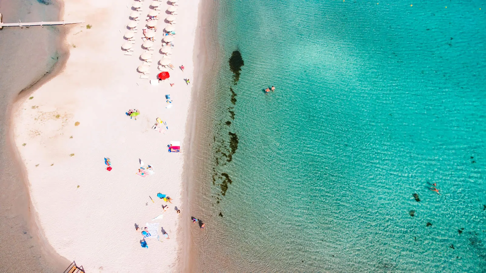 Porto Taverna beach from above in September, quiet sand and turquoise sea