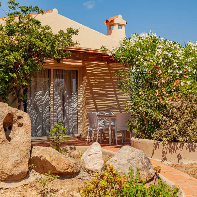 Villa tucked between granite rocks and flowering shrubs