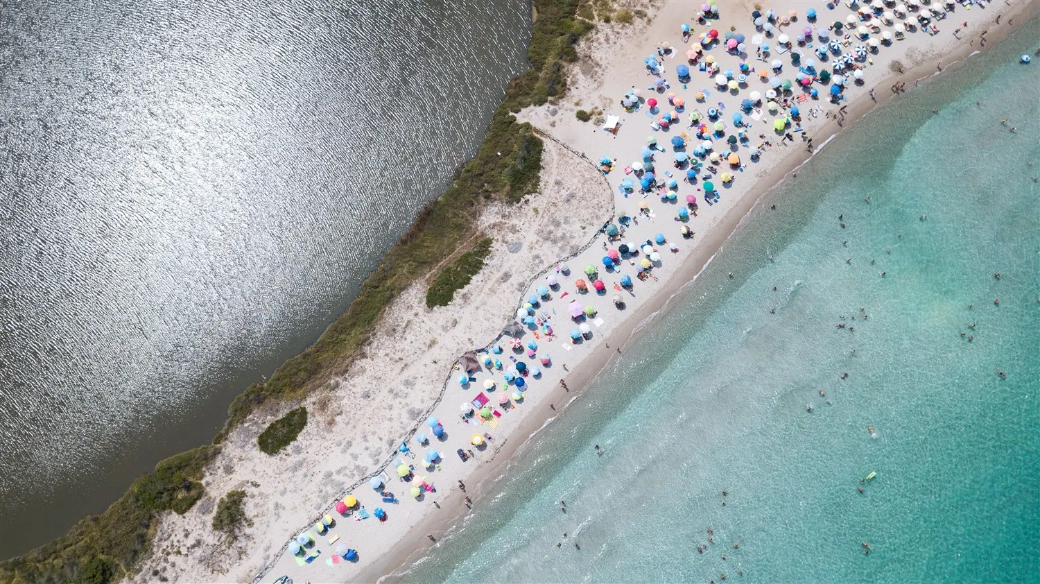 Aerial view of Porto Taverna beach between the lagoon and the sea