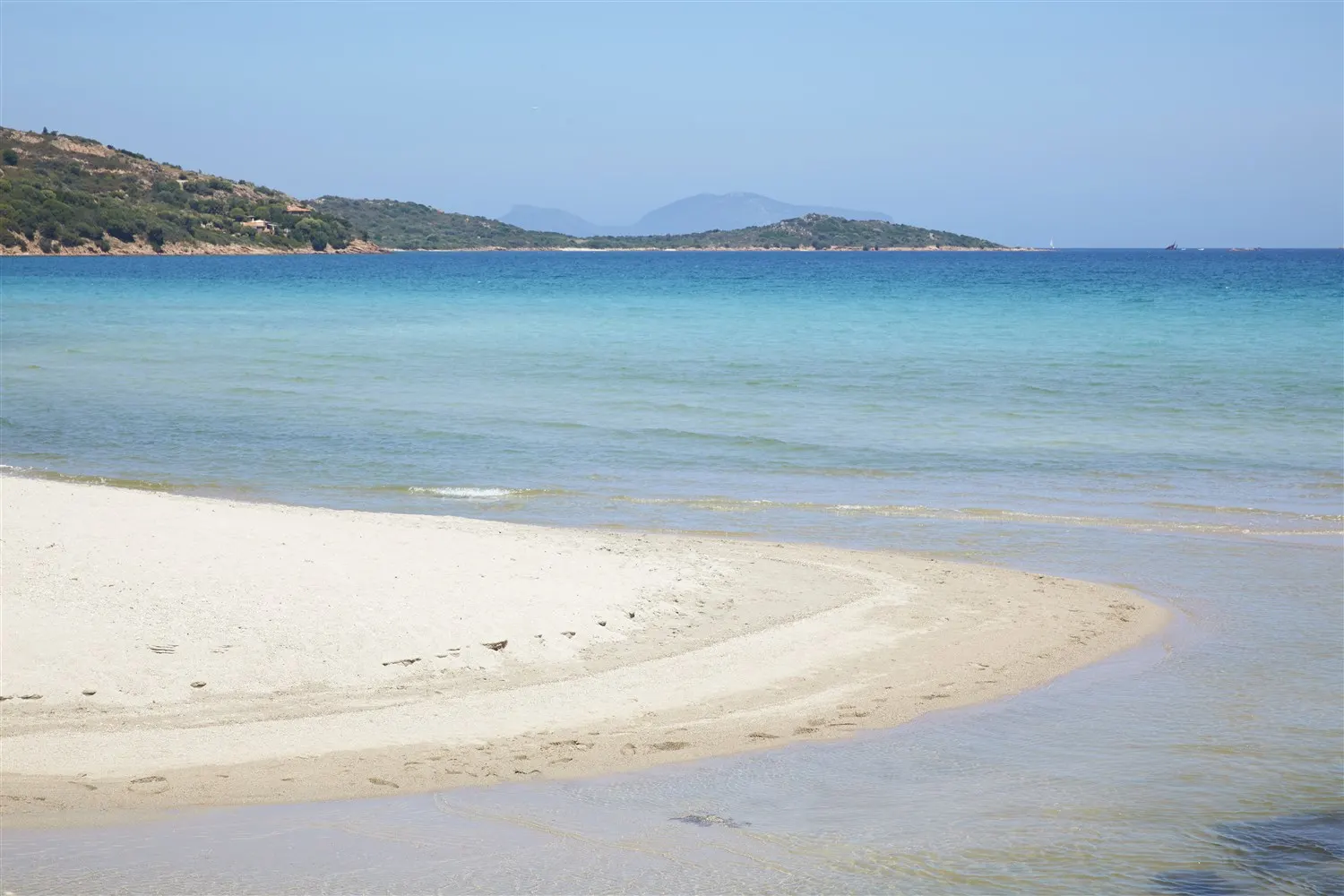 Shallow turquoise water at Porto Taverna beach